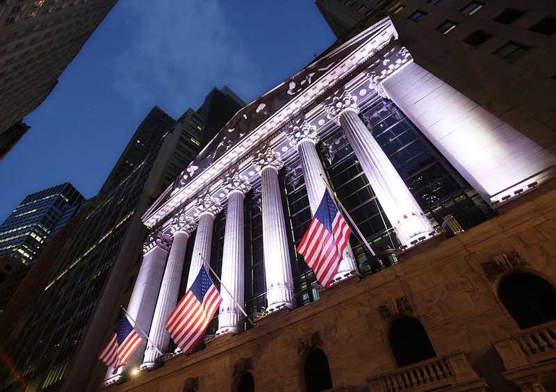 
              FILE - In this Oct. 8, 2014, file photo, American flags fly in front of the New York Stock Exchange. Global stocks mostly rose Monday, Aug. 15, 2016, despite subdued growth figures for Japan, as investors looked ahead to U.S. economic data this week as well as the minutes to the Federal Reserve's last meeting. (AP Photo/Mark Lennihan, File)
            
