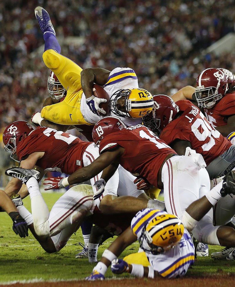 In this Nov. 7, 2015, file photo, LSU running back Leonard Fournette (7) tries to reach the end zone as the Alabama defense holds at the line in the second half of an NCAA college football game in Tuscaloosa, Ala. (AP Photo/John Bazemore, File)
            