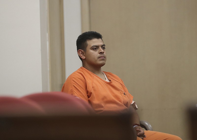 
              FILE--In this July 29, 2016, file photo, Edwin Lara, a security guard at Central Oregon Community College in Bend, Ore., waits in court in Yreka, Calif., for his arraignment. The murder of Kaylee Sawyer, from Bend, Ore., followed by a string of other crimes leading from Oregon through California allegedly committed by Lara has the scenic mountain town or Bend, Ore., deeply shaken. (Greg Barnette/The Record Searchlight via AP, file)
            