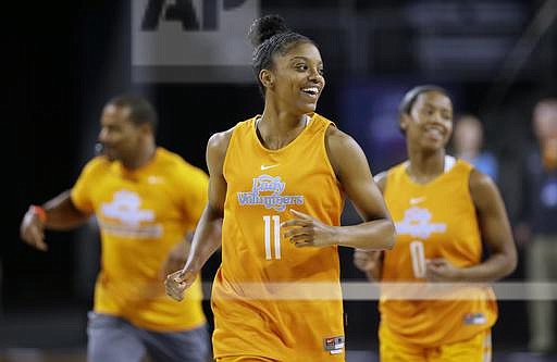 FILE - In this March 24, 2016, file photo, Tennessee guard Diamond DeShields laughs with teammates during practice ahead of a regional semifinal women's college basketball game in the NCAA Tournament, in Sioux Falls, S.D. DeShields' supreme confidence took a major hit during a 2015-16 season she called "extremely disappointing." Now she has it back and wants to help the Lady Volunteers reclaim their status as national contenders. (AP Photo/Charlie Neibergall, FIle)