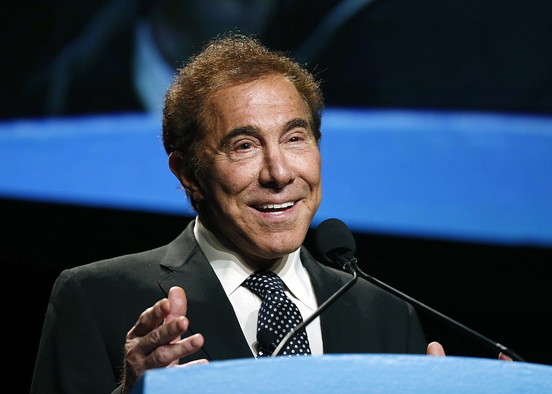 
              FILE - In this Jan. 15, 2015, file photo, Steve Wynn, CEO of Wynn Resorts, delivers the keynote address at Colliers International Annual Seminar at the Boston Convention Center in Boston. From a pair of giant golden dragons on the edge of a vast man-made lagoon to phoenix and cloud motifs throughout the interior, Wynn’s new multibillion dollar Macau resort brims with auspicious Chinese symbolism. The U.S. casino mogul will be hoping luck is on his side as he prepares to launch his Wynn Palace project in the Asian gambling hub, where growth is downshifting into a new phase after years of turbocharged expansion. (AP Photo/Elise Amendola, File)
            