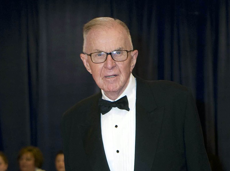 FILE - In this April 28, 2012 file photo, John McLaughlin arrives at the White House Correspondents' Association Dinner in Washington. McLaughlin, the conservative political commentator and host of the namesake long-running television show that pioneered hollering-heads discussions of Washington politics, died Tuesday, Aug. 16, 2016, according to the Facebook page for "The McLaughlin Group." He was 89. (AP Photo/Kevin Wolf, File)