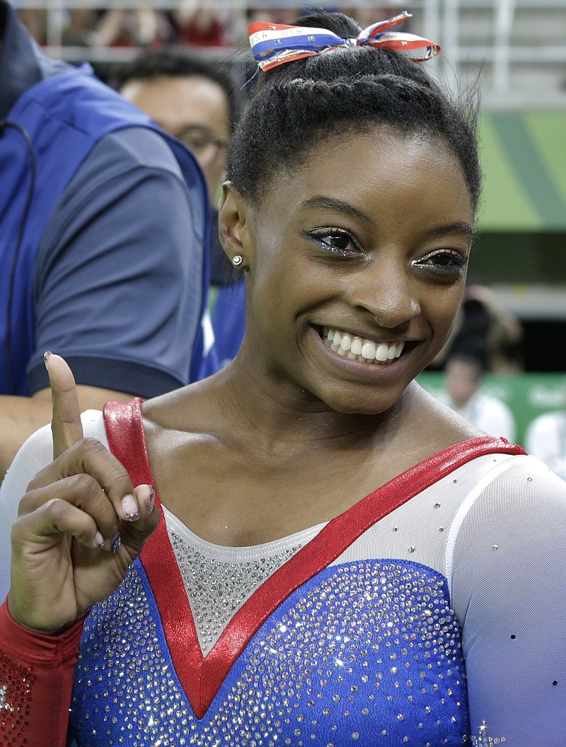United States' Simone Biles gestures after winning gold in floor during the artistic gymnastics women's apparatus final at the 2016 Summer Olympics in Rio de Janeiro, Brazil, Tuesday, Aug. 16, 2016.
