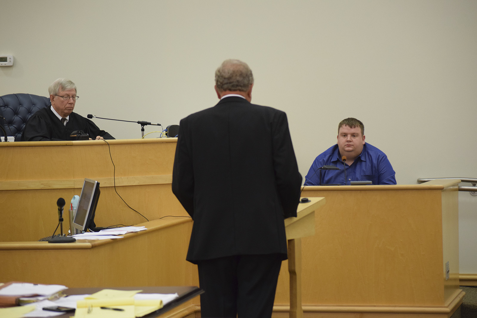 Criminal Court Judge Thomas "Rusty" Graham listens as defense attorney William Bullock talks to Russell about his decision on testifying.