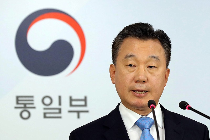 
              South Korean Unification Ministry spokesman Jeong Joon Hee speaks about a senior North Korea diplomat's defection to South Korea during a press conference at the government complex in Seoul, South Korea, Wednesday, Aug. 17, 2016. Unification Ministry said Wednesday that Thae Yong Ho, minister at the North Korean Embassy in London, recently defected to South Korea with his family. The sign reads " Unification Ministry". (Kim Hyun-tae/Yonhap via AP)
            