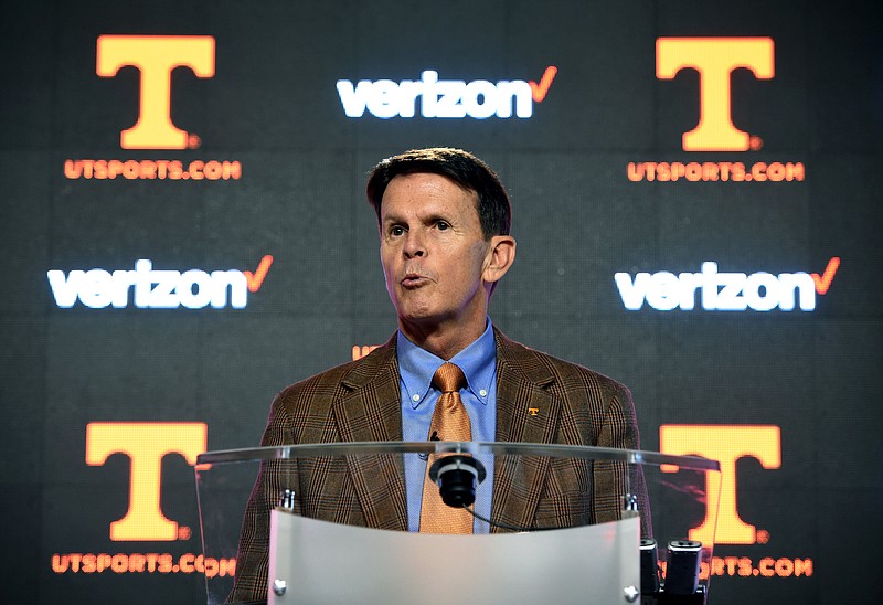 FILE - In this Feb. 15, 2016, file photo, Tennessee athletic director Dave Hart answers questions during a press conference in Knoxville, Tenn. Tennessee athletic director Dave Hart says he is retiring effective June 30 after a five-year run in which he managed the consolidation of the men's and women's athletic departments while also dealing with plenty of controversy. (Adam Lau/Knoxville News Sentinel via AP, File)