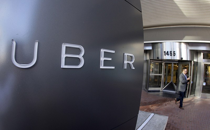 
              FILE - In this Dec. 16, 2014, file photo a man leaves the headquarters of Uber in San Francisco.  Uber and Volvo announced, Thursday, Aug. 17, 2016,  a $300 million deal for Volvo to provide SUVs to Uber for autonomous vehicle research. Eventually the Volvo SUVs will be part of the self-driving fleet in Pittsburgh.(AP Photo/Eric Risberg, File)
            