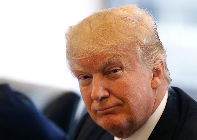 
              Republican presidential candidate Donald Trump smiles as he participates in a roundtable discussion on national security in his offices in Trump Tower in New York, Wednesday, Aug. 17, 2016. (AP Photo/Gerald Herbert)
            