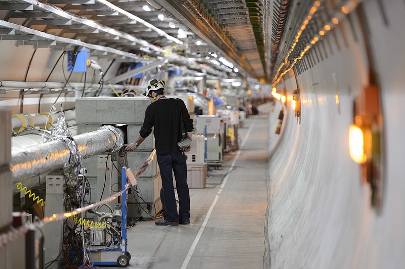 
              FILE - In this Feb. 16, 2016 file photo a technician works in the LHC (Large Hadron Collider) tunnel of the European Organization for Nuclear Research, CERN, during a press visit in Meyrin, near Geneva, Switzerland. Officials at CERN, home to the world’s largest particle accelerator, say they’ve launched an internal investigation over a “spoof” video filmed on its campus appearing to mimic a human sacrifice. (Laurent Gillieron/Keystone via AP, file)
            