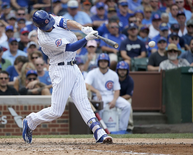 
              Chicago Cubs' Kris Bryant hits an RBI double off Milwaukee Brewers starting pitcher Zach Davies, scoring Matt Szczur, during the fourth inning of a baseball game Thursday, Aug. 18, 2016, in Chicago. (AP Photo/Charles Rex Arbogast)
            