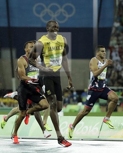Usain Bolt from Jamaica leads to win the gold medal in the men's 200-meter finalduring the athletics competitions of the 2016 Summer Olympics at the Olympic stadium in Rio de Janeiro, Brazil, Thursday, Aug. 18, 2016. (AP Photo/Jae C. Hong)