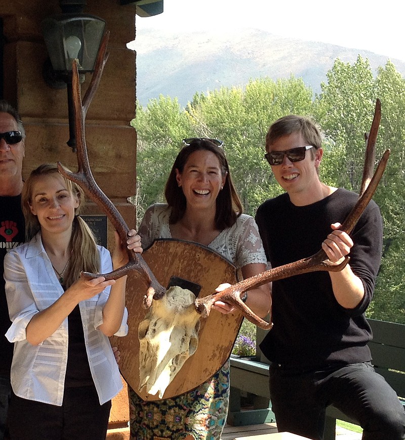 
              TAKES OUT REFERENCE TO ASSISTANT REGIONAL  LIBRARIAN - Anita Thompson, left, is joined by Library Executive Director Jenny Emery Davidson, middle, and Program Manager Scott Burton as they pose with trophy antlers while returning them to the former home of writer Ernest Hemingway Aug. 5, 2016, in Ketchum, Idaho. Gonzo journalist Hunter S. Thompson so admired the set of trophy elk antlers when he visited the central Idaho home of Hemingway, that he stole them. More than half a century later, The Community Library has returned the antlers.(Christina Jensen/The Community Library via AP)
            