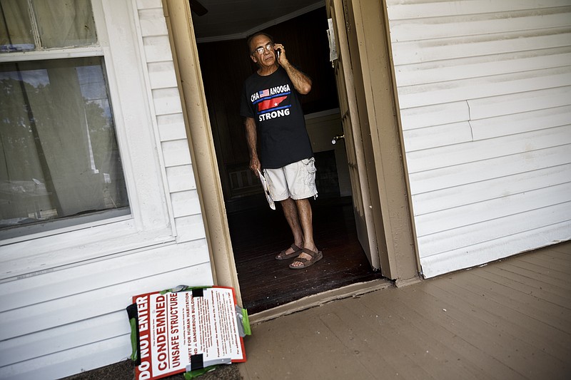 Landlord Ron Bhalla calls a potential tenant from one of his properties in East Chattanooga that was recently brought back to code after being condemned by city codes inspectors on Thursday, Aug. 11, 2016, in Chattanooga, Tenn. Some area landlords are speaking out against codes inspectors, who they say use unfair practices in condemning properties.