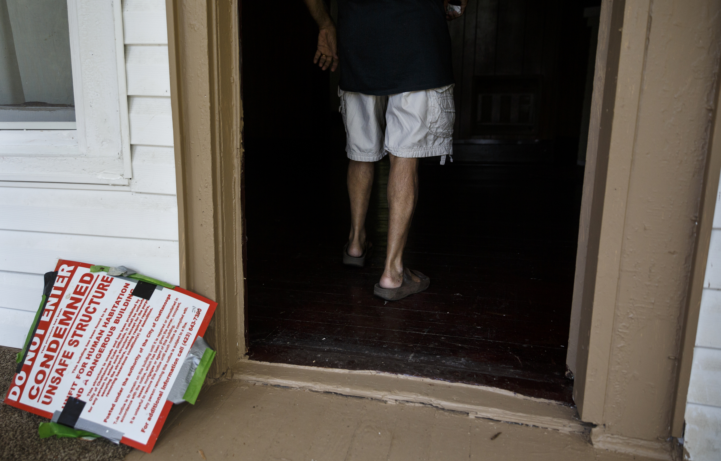 Landlord Ron Bhalla enters one of his properties in East Chattanooga that was recently brought back to code after being condemned by city codes inspectors on Thursday, Aug. 11, 2016, in Chattanooga, Tenn. Some area landlords are speaking out against codes inspectors, who they say use unfair practices in condemning properties.