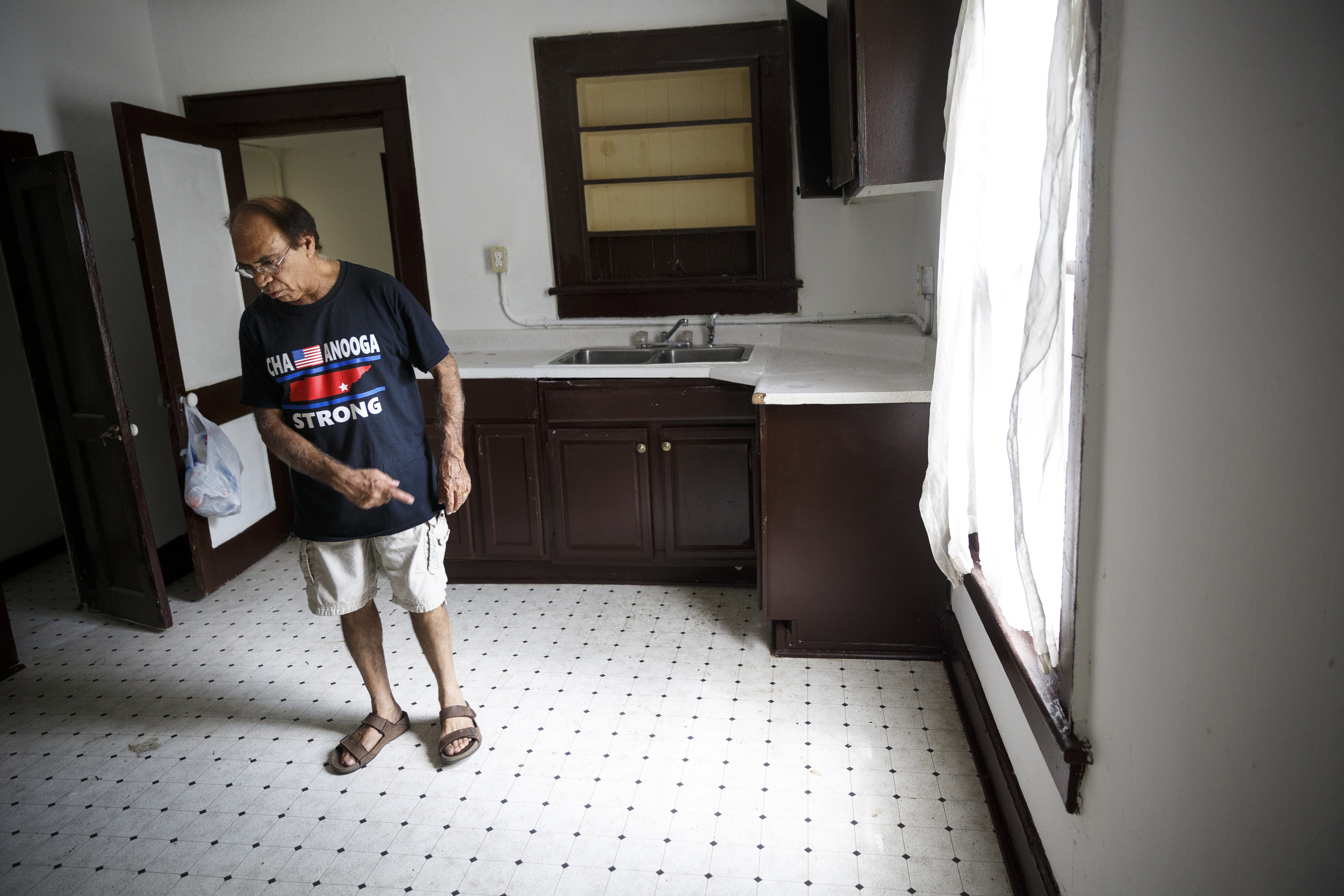 Landlord Ron Bhalla talks about the kitchen floor cited in one of his properties in East Chattanooga that was recently brought back to code after being condemned by city codes inspectors on Thursday, Aug. 11, 2016, in Chattanooga, Tenn. Some area landlords are speaking out against codes inspectors, who they say use unfair practices in condemning properties.