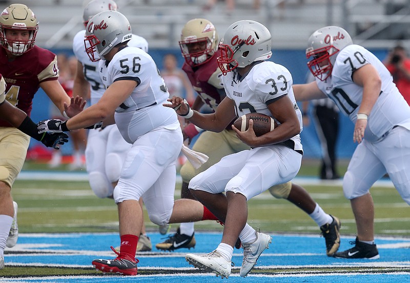 Ooltewah's Cameron Turner (33) runs the ball down during the Middle Tennessee Football Classic Game #1, against Riverdale, on Saturday, Aug. 20, 2016.