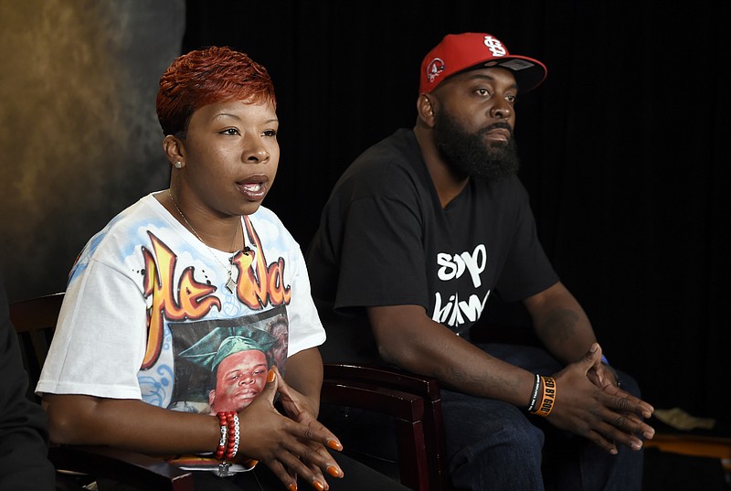 
              FILE - In this Sept. 27, 2014, file photo, the parents of Michael Brown, Lesley McSpadden, left, and Michael Brown, Sr., sit for an interview with The Associated Press in Washington. Defense attorneys in the wrongful-death lawsuit by Michael Brown's parents cite recent ambushes of police in Texas and Louisiana among reasons against expanding who can see sensitive grand jury details related to Brown's Ferguson 2014 death. (AP Photo/Susan Walsh, File)
            