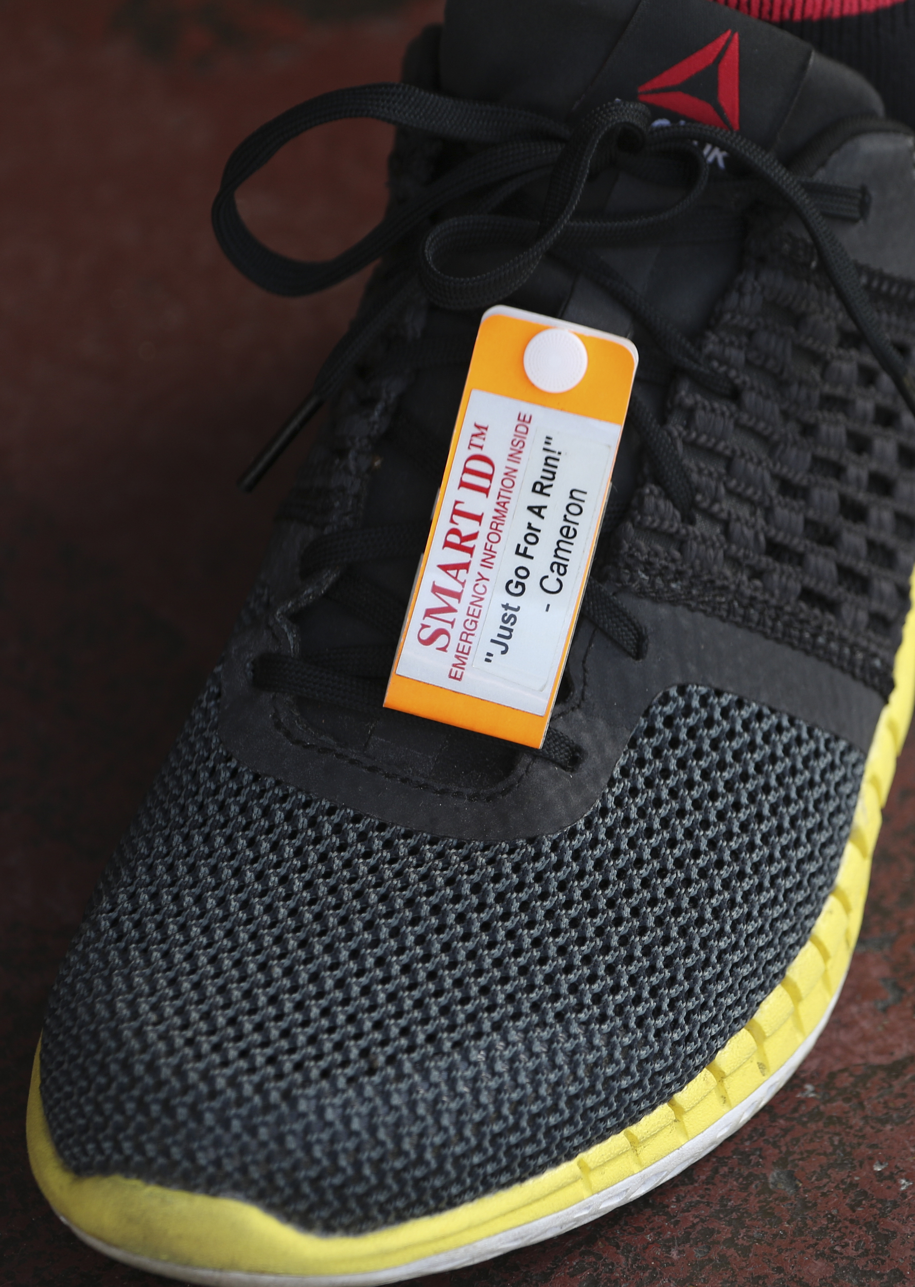 Staff Photo by Dan Henry / The Chattanooga Times Free Press- 8/18/16. Steve Bean wears an ID shoe tag inspired by his late son Cameron Bean while at Fast Break Athletics on Thursday, August 18, 2016.