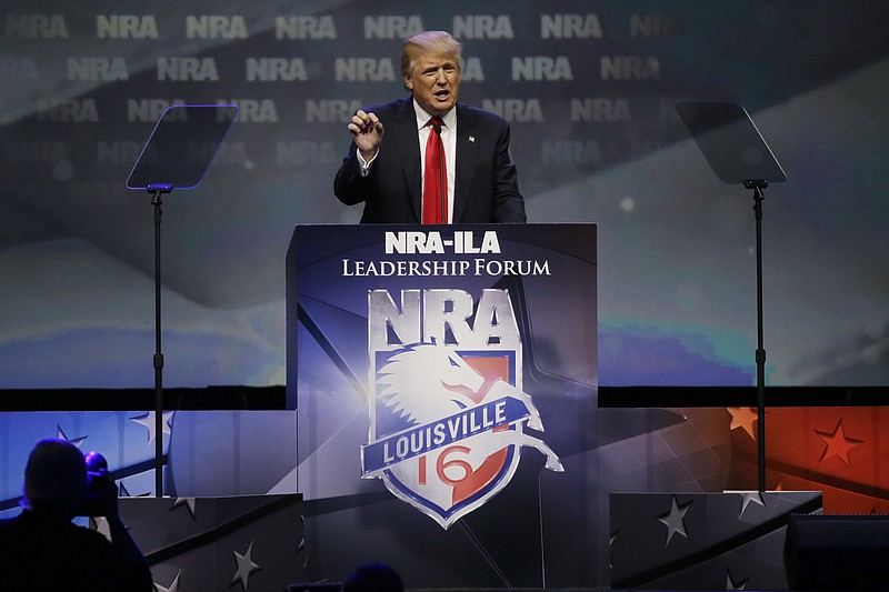 
              FILE - In this May 20, 2016 file photo, Republican presidential candidate Donald Trump speaks at the National Rifle Association convention in Louisville, The National Rifle Association’s political committee is pooling together small contributions to run attack ads against Democratic presidential nominee Hillary Clinton.(AP Photo/Mark Humphrey, File)
            