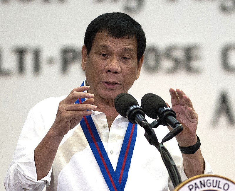 
              FILE - In this Wednesday, Aug. 17, 2016 file photo, Philippine President Rodrigo Duterte gestures as he talks during the 115th Police Service Anniversary at the Philippine National Police headquarters in Manila. The Philippines' brash-talking president has threatened to withdraw his country from the United Nations in his latest outburst against critics of his anti-drugs campaign that has left hundreds of suspects dead. Duterte ridiculed the U.N. as inutile, and lashed at U.S. police killings of black men. (Noel Celis/Pool Photo via AP, File)
            