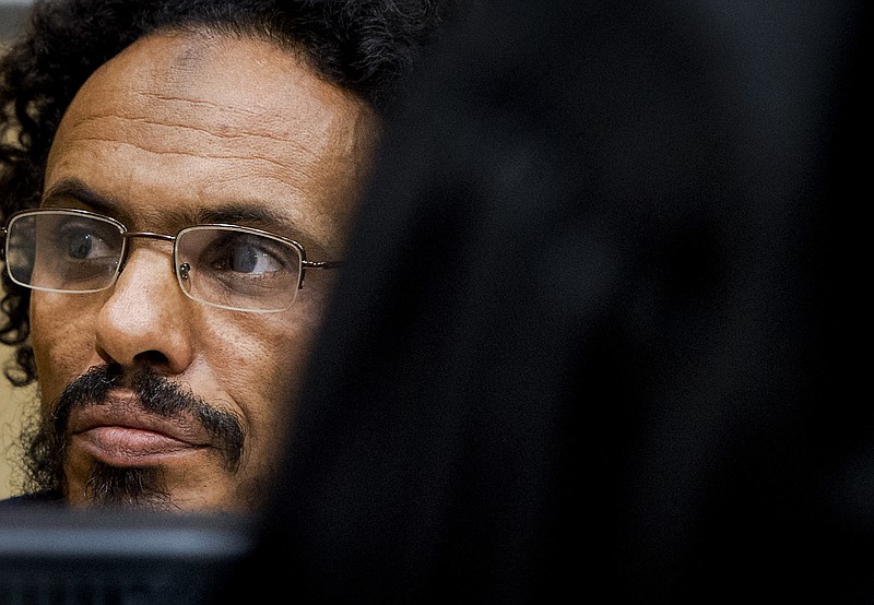 
              FILE - This is a Wednesday, Sept. 30, 2015 file photo of Ahmad Al Faqi Al Mahdi waits in the court room for his initial appearance at the International Criminal Court in The Hague, Netherlands.  Ahmad Al Faqi Al Mahdi an Islamic radical accused of involvement in destroying historic mausoleums in the Malian desert city of Timbuktu goes on trial at the International Criminal Court on Monday Aug. 22, 2016  and has already told judges he intends to plead guilty. (AP Photo/Robin van Lonkhuijsen, Pool, File)
            