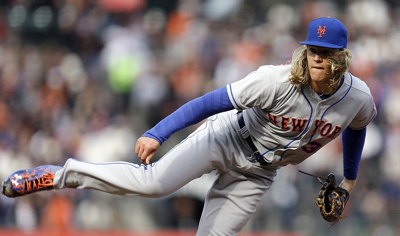 
              New York Mets pitcher Noah Syndergaard works against the San Francisco Giants in the first inning of a baseball game, Sunday, Aug. 21, 2016, in San Francisco. (AP Photo/Ben Margot)
            