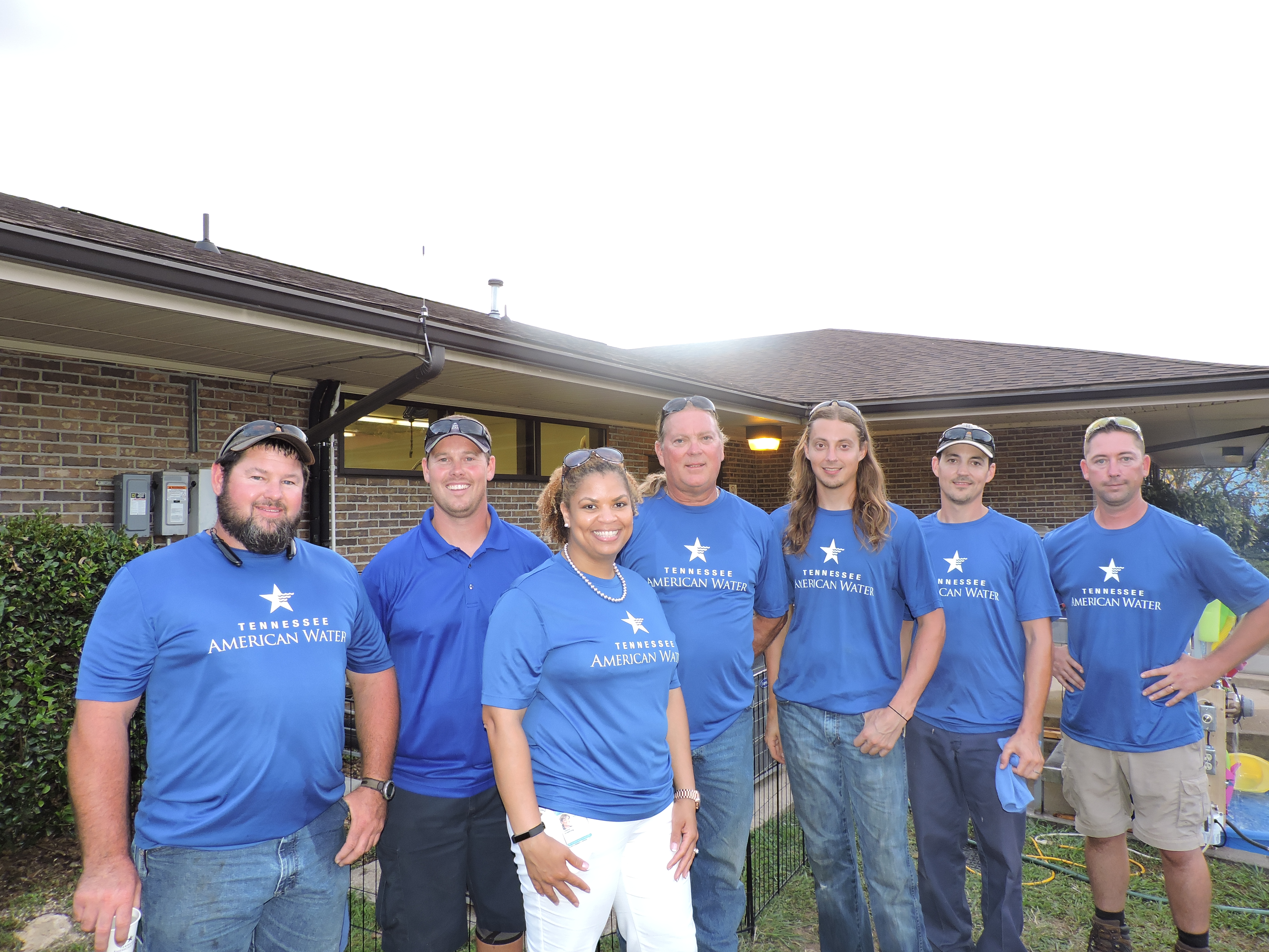 TAW employees use the day as an education and outreach tool. From left are truck driver/utility worker John Denton, field service representative Steve Brown, President Valoria Armstrong, heavy equipment operator Jack Derryberry, field service representatives Seth Derryberry and Elijah Derryberry and utility truck driver Courtney Johnson.