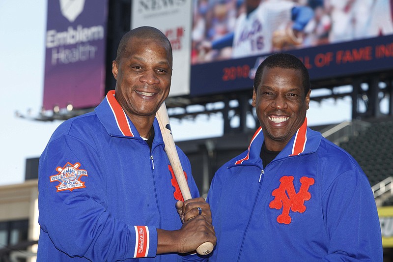 
              FILE - This Aug. 1, 2010, file photo shows former New York Mets' players Dwight Gooden, right, and Darryl Strawberry posing at Citi Field in New York. Gooden has denied, Monday, Aug. 22, 2016, Darryl Strawberry’s accusation that he is “a complete junkie-addict,” saying his former teammate is just taking it personally that Gooden could not make a scheduled public appearance with Strawberry last week. (AP Photo/Seth Wenig, File)
            