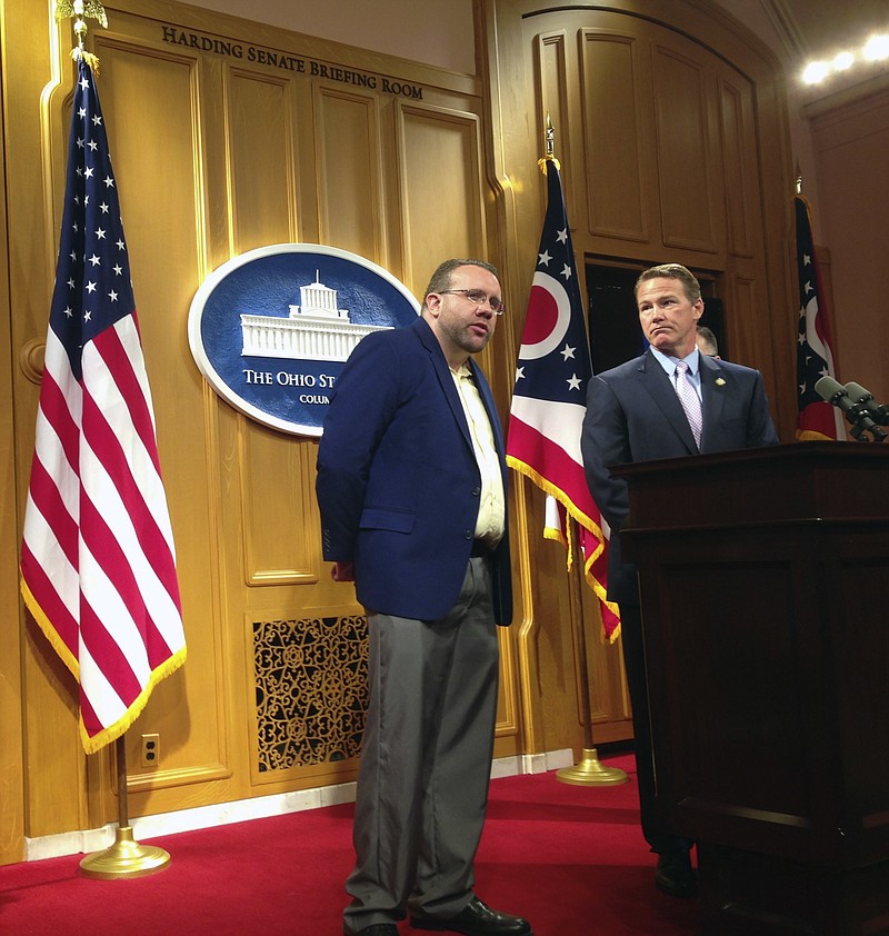 
              Ohio Secretary of State Jon Husted, right, joins Jason LaMar in taking questions from the media about an iBook LaMar helped to create, during a news conference in Columbus, Ohio, Tuesday, Aug. 23, 2016. The iBook, "Ohio: Pathway to the Presidency," seeks to highlight Ohio's role in the upcoming presidential election and provides biographical details on eight former presidents who called the state home. (AP Photo/Ann Sanner)
            