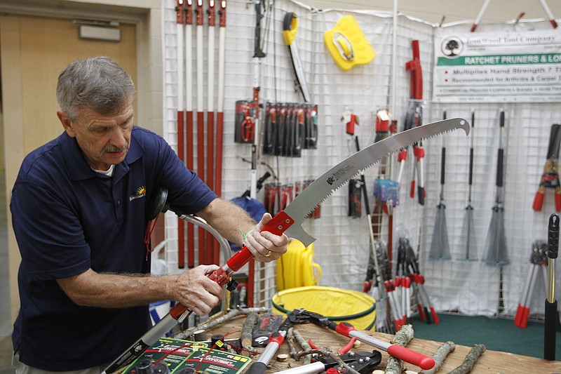 Henry Sims with Horizons Ltd. demonstrates the operation of an extendable saw at a previous Fall Home & Remodeling Show at the Chattanooga Convention Center.