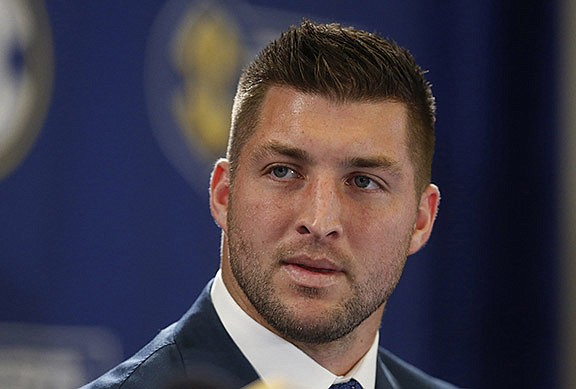 In this Dec. 5, 2014, file photo, Tim Tebow speaks during an SEC television broadcast in Atlanta. (AP Photo/Brynn Anderson, File)