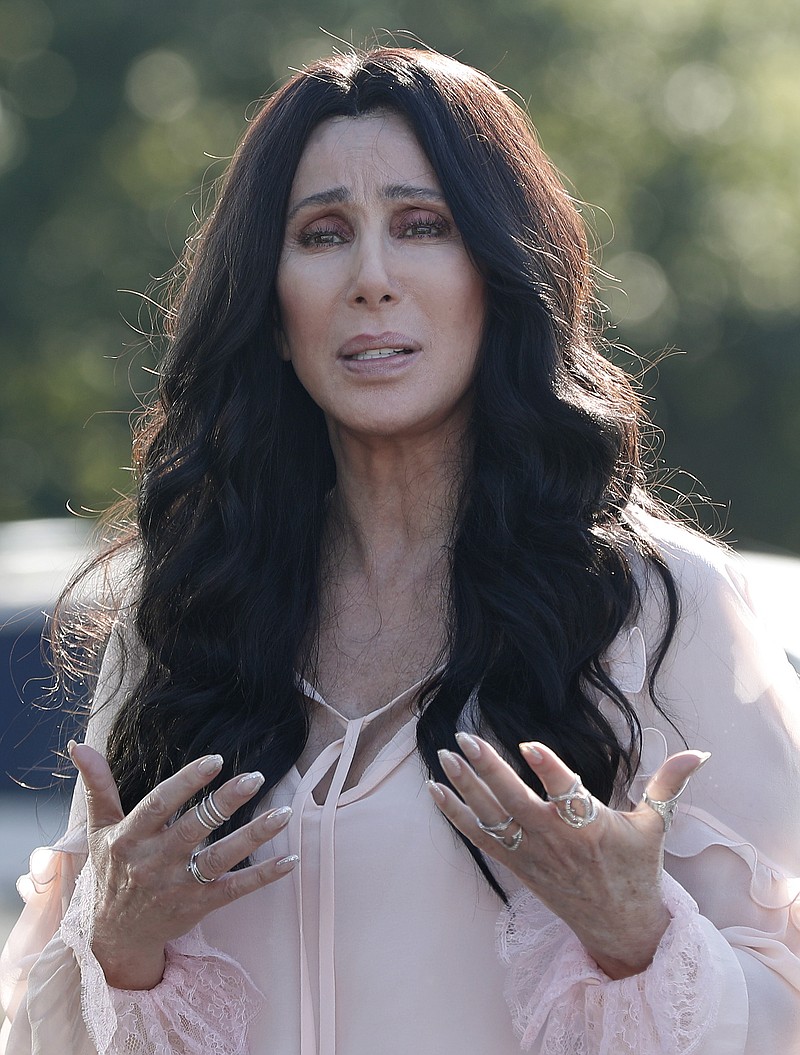 
              Singer and actress Cher stops to talk to media as she leaves a fundraiser for Democratic presidential candidate Hillary Clinton at the Pilgrim Monument and Provincetown Museum in Provincetown, Mass., Sunday, Aug. 21, 2016. (AP Photo/Carolyn Kaster)
            