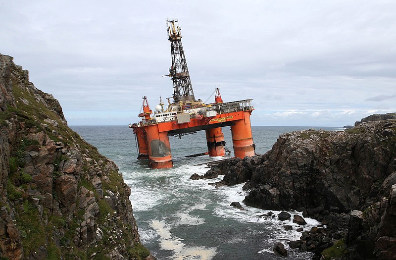 
              FILE - In this file photo dated Oct. 9, 2016, showing the Transocean Winner drilling rig as it broke free from tug boats in rough seas and ran aground off the Isle of Lewis, Outer Hebrides, Scotland.  Final preparations are being made for high tide on Monday Aug. 22, 2016, to re-float the 17,000-tonne oil rig carrying some 280 tons of diesel on board.  (Andrew Milligan / PA FILE via AP)
            