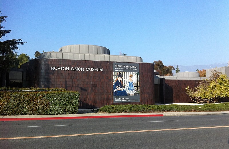 
              FILE - This Jan. 21, 2015, file photo shows the exterior of the Norton Simon Museum in Pasadena, Calif. A woman who has been fighting for almost a decade over ownership of two German Renaissance masterpieces depicting "Adam" and "Eve" seized by the Nazis during World War II, has lost after a judge ruled in favor of the Southern California museum where they have hung for more than 30 years. U.S. District Court Judge John F. Walter ruled that the Norton Simon Museum is the rightful owner of the two life-size oil-on-panel paintings in a decision that the museum describes as mindful of "the facts and law at the heart of the dispute." (AP Photo/John Antczak, File)
            