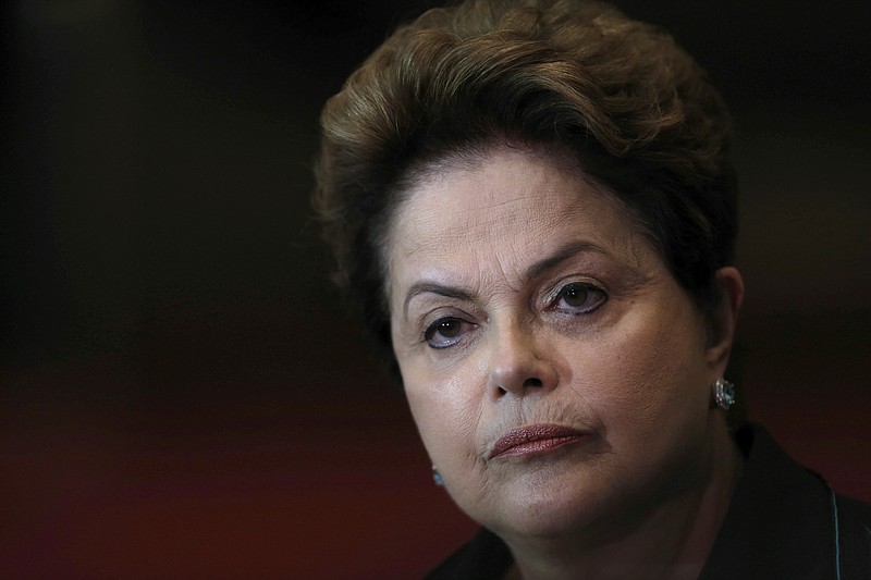 
              FILE - In this Oct. 6, 2014 file photo, Brazil's President Dilma Rousseff listens to a question during a re-election campaign news conference at the Alvorada Palace in Brasilia, Brazil. Just days after the Rio Olympics ended, Brazilian senators are now gearing up for a final decision on whether to permanently remove President Dilma Rousseff from office. The months-long leadership fight has brought to the surface deep polarization in Latin America's most populous nation, fueled by anger over endemic corruption and angst about an emerging economy that has gone from darling to depression amid its worst financial crisis in decades. (AP Photo/Eraldo Peres, File)
            