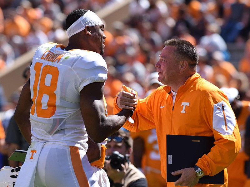 Tennessee fifth-year senior Jason Croom, left, and coach Butch Jones are preparing for next Thursday's season opener against Appalachian State in Knoxville. Croom, a former wide receiver who missed last season because of injury, is now a 6-foot-5, 250-pound tight end.