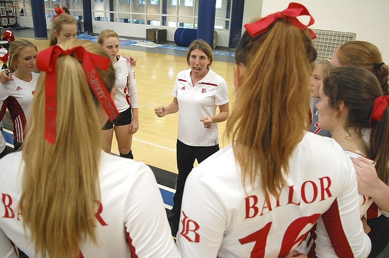 Baylor volleyball coach Sarah Lail, center, has the Lady Red Raiders undefeated through 11 matches this season.