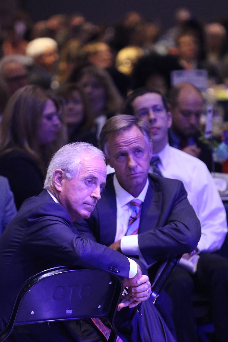 Staff Photo by Dan Henry / The Chattanooga Times Free Press- 8/24/16. Senator Bob Corker and Governor Bill Haslam listen to presentations during the Chattanooga Area Chamber of Commerce's annual meeting on Wednesday, August 24, 2016. 