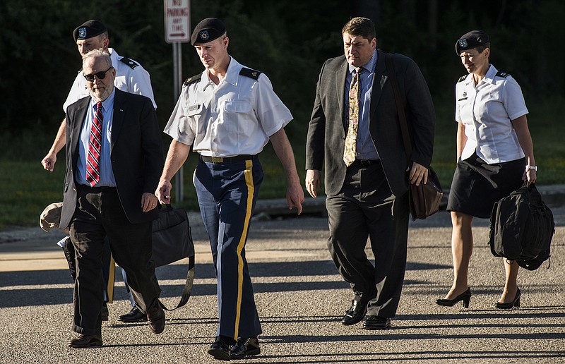 
              Sgt. Bowe Bergdahl, second from left, and some of his attorneys arrive the courthouse Monday, Aug 22, 2016, at Fort Bragg, N.C. Attorneys for Bergdahl are scheduled to argue Tuesday that decision-makers with power over the soldier's prosecution were improperly swayed by negative comments from U.S. Sen. John McCain.
(Raul R. Rubiera/The Fayetteville Observer via AP)
            