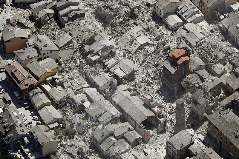 Aerial view of Amatrice in central Italy, Wednesday, Aug. 24, 2016, as it appears after a magnitude 6 quake struck at 3:36 a.m. (0136 GMT) and was felt across a broad swath of central Italy, including Rome where residents of the capital felt a long swaying followed by aftershocks. (AP Photo/Gregorio Borgia)