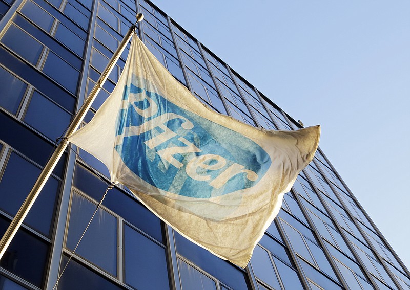 
              FILE - In this Monday, Nov. 23, 2015, file photo, the Pfizer flag flies in front of world headquarters in New York. On Wednesday, Aug. 24, 2016, drugmaker Pfizer said it's buying rights to Anglo-Swedish drugmaker AstraZeneca PLC's portfolio of approved and experimental antibiotic and antifungal pills, a move to boost Pfizer's business in one of its priority areas. The deal is valued in excess of $1.5 billion, including rights to sell the medicines in most countries outside the U.S., royalties and other payments. (AP Photo/Mark Lennihan, File)
            