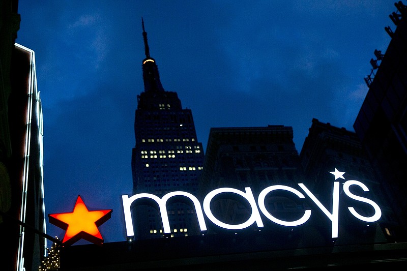 
              FILE - In this Nov. 21, 2013, file photo, with the Empire State building in the background, the Macy's logo is illuminated on the front of the department store in New York. It turns out there’s a wealth gap among companies, just like among people. Of the $1.8 trillion in cash that’s sitting in U.S. corporate accounts, half of it belongs to just 25 of the 2,000 companies tracked by S&P Global Ratings.  In March 2016, S&P cut its ratings on Macy's to BBB, two notches above junk, as competition from internet retailers continues to dig into the department store chain's sales. (AP Photo/Mark Lennihan, File)
            