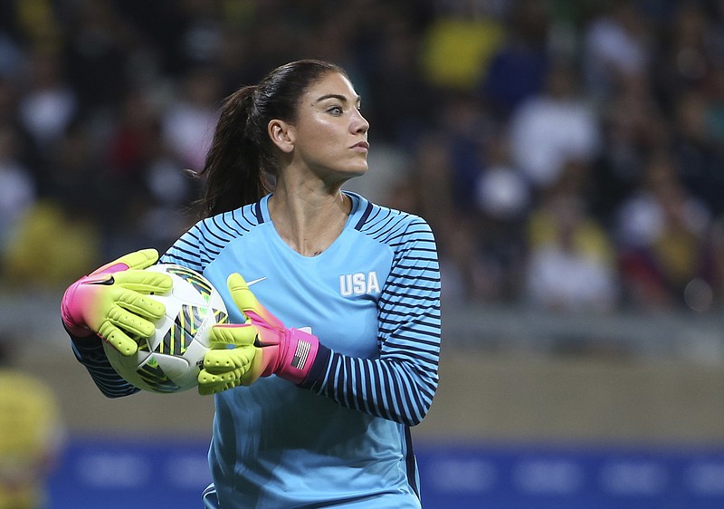 
              FILE - In this Aug. 3, 2016, file photo, U.S. goalkeeper Hope Solo takes the ball during a women's Olympic football tournament match against New Zealand in Belo Horizonte, Brazil. Solo has been suspended form the team for six months for what U.S. Soccer termed conduct "counter to the organization's principles." The suspension is effective immediately. U.S. Soccer President Sunil Gulati said Wednesday, Aug. 24, that comments Solo made after the U.S. lost to Sweden during the Rio Olympics were "unacceptable and do not meet the standard of conduct we require from our National Team players." (AP Photo/Eugenio Savio, File)
            