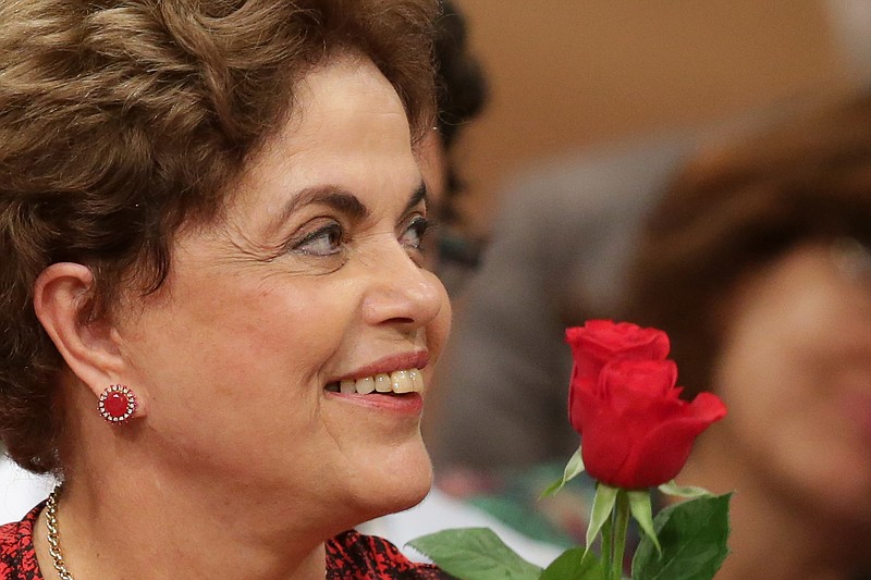 
              Brazil's suspended President Dilma Rousseff smiles during a rally in Brasilia, Brazil, Wednesday, Aug. 24, 2016. Brazil’s Senate braces for a final showdown in a trial that could overthrow President Rousseff after months of lengthy proceedings in Congress. She is accused of breaking fiscal laws, in managing the federal budget as her government ran out of resources. (AP Photo/Eraldo Peres)
            