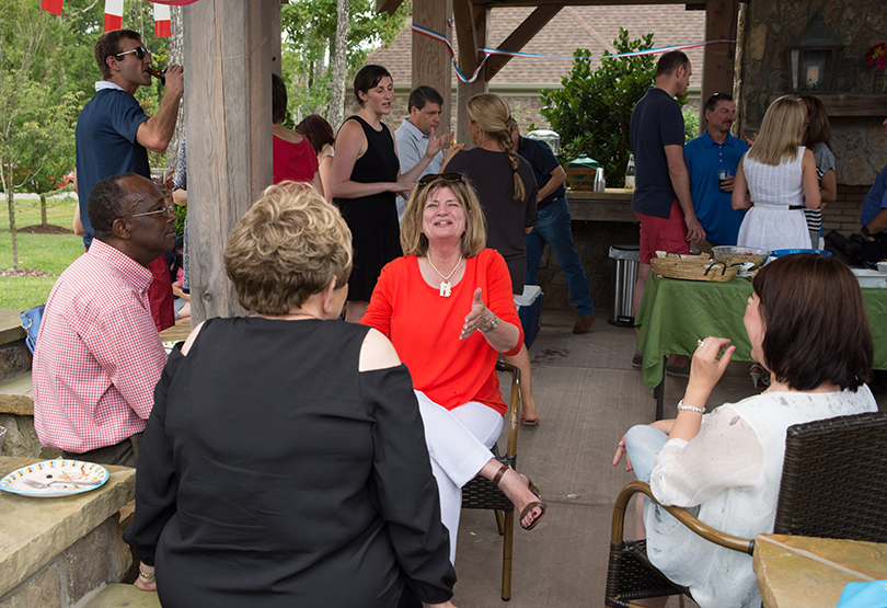 Gardner Rustand (center) sharing stories.