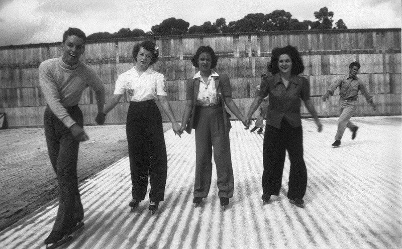 Left: Ruby Abbott, second from left, and friends enjoy a day at the ice skating rink on Hawaii's North Shore. Concerns about a Japanese invasion prompted the U.S. Navy to enclose Waikiki Beach with barbed wire, pile sandbags against residences and offices and sound an air raid siren when enemy planes or subs were spotted. But civilian workers were still able to enjoy Hawaii's beauty.