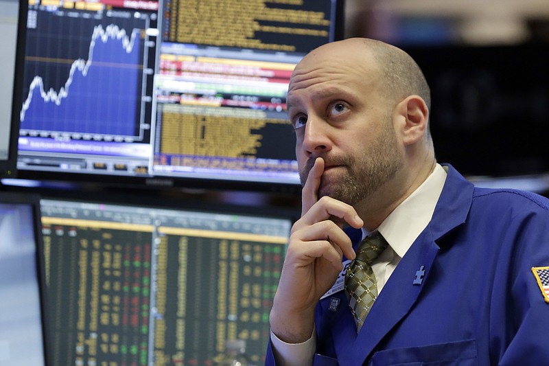 FILE - In this Monday, May 9, 2016, file photo, specialist Meric Greenbaum works on the floor of the New York Stock Exchange. Even as the market set record highs in July, investors remained skeptical of stocks and pulled out nearly as much money from stock funds as they deposited. Bond and gold funds, meanwhile, are hot.  (AP Photo/Richard Drew, File)