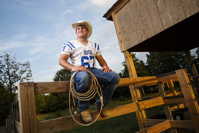 Boyd-Buchanan junior linebacker and fullback Will Watkins, who is also an accomplished rodeo athlete with numerous national award buckles and saddles, is photographed at his family's farm Wednesday, Aug. 24, 2016, in Ringgold, Ga.