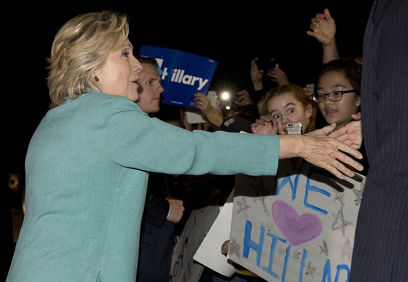 
              Democratic presidential nominee Hillary Clinton greets people outside on the street as she leaves a fundraiser in Piedmont, Calif., Tuesday, Aug. 23, 2016. (AP Photo/Carolyn Kaster)
            