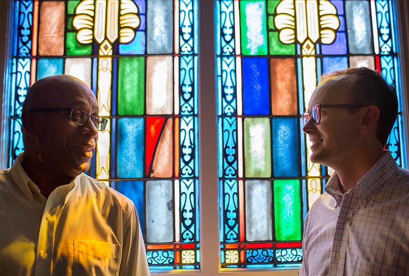 
              ADVANCE FOR USE MONDAY, AUG. 29, 2016 AND THEREAFTER-The Rev. James W. Goolsby, Jr., senior pastor of the First Baptist Church, left, and the Rev. Scott Dickison, senior pastor of First Baptist Church of Christ, right, pose for a photo at Dickison's church in Macon, Ga., on Monday, July 11, 2016. There are two First Baptist Churches in Macon _ one black and one white. Two years ago, Dickison and Goolsby met to try to find a way the congregations, neighbors for so long, could become friends. They’d try to bridge the stubborn divide of race. (AP Photo/Branden Camp)
            